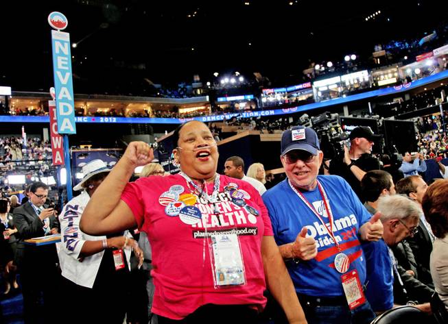 Nevada delegates Edith Byrd and Richard Miller cheer Sen. Harry Reid after his speech to the Democratic National Convention in Charlotte, N.C., Tuesday night.